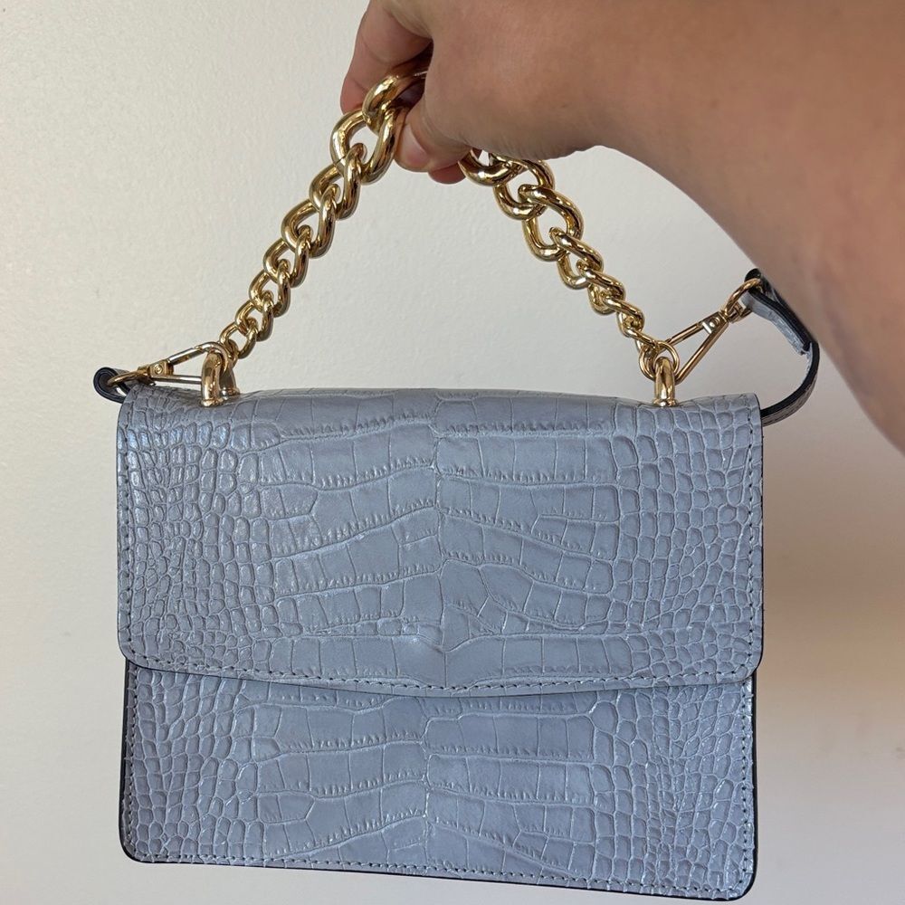Elegant house of Harlow Blue Croc-Embossed Handbag with Gold Chain